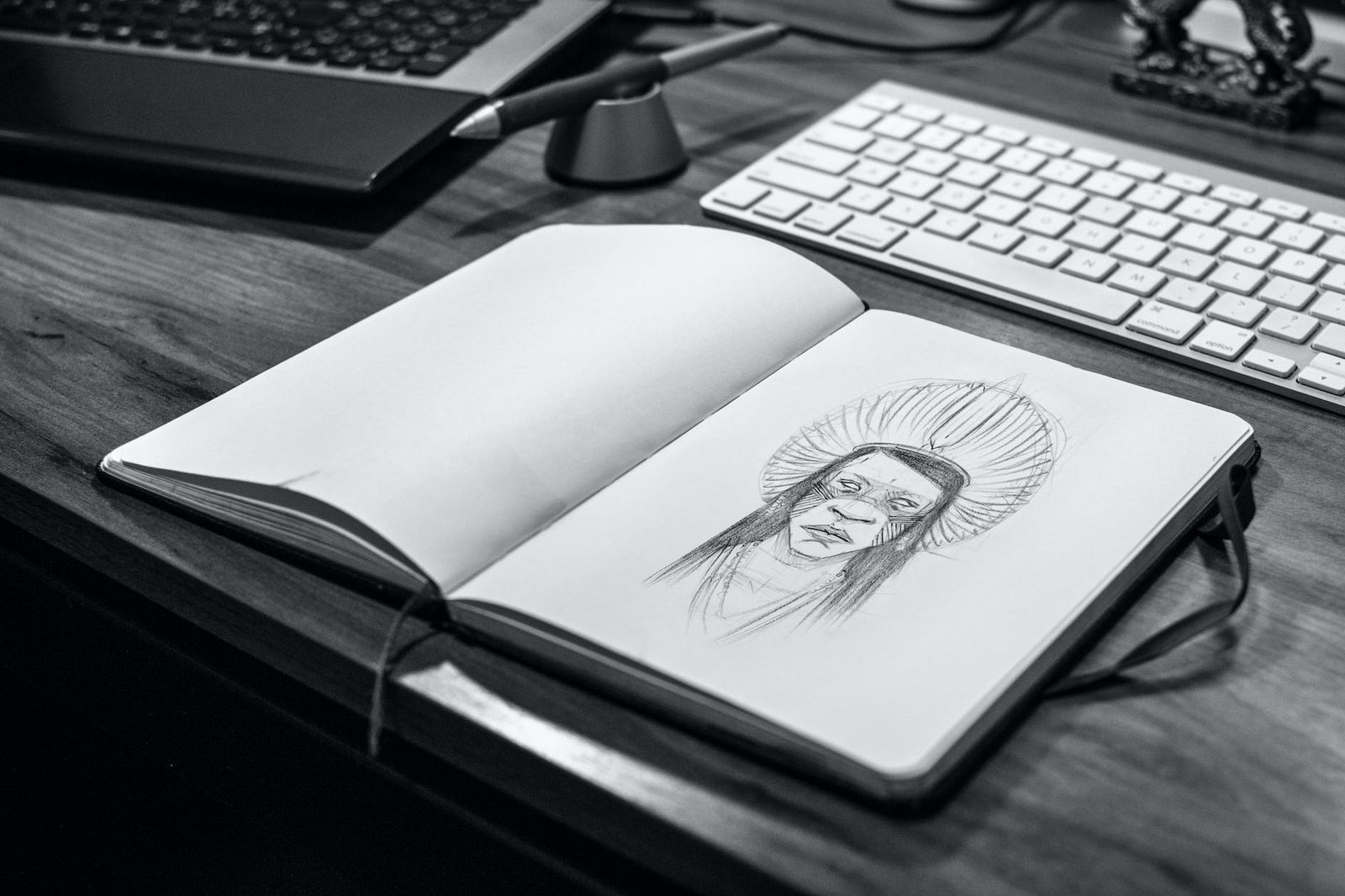 sketch book on gray wooden surface